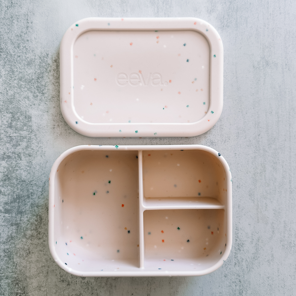 eeva Trio Bento silicone bento lunch box with 3 compartments in Confetti Blush speckle, lid off.